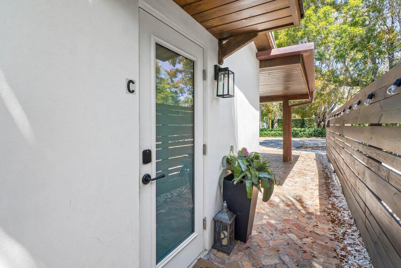 706 Sunset Road, Unit C West Palm Beach, FL 33401 - Photo 4 of 15 a view of a house with a potted plant