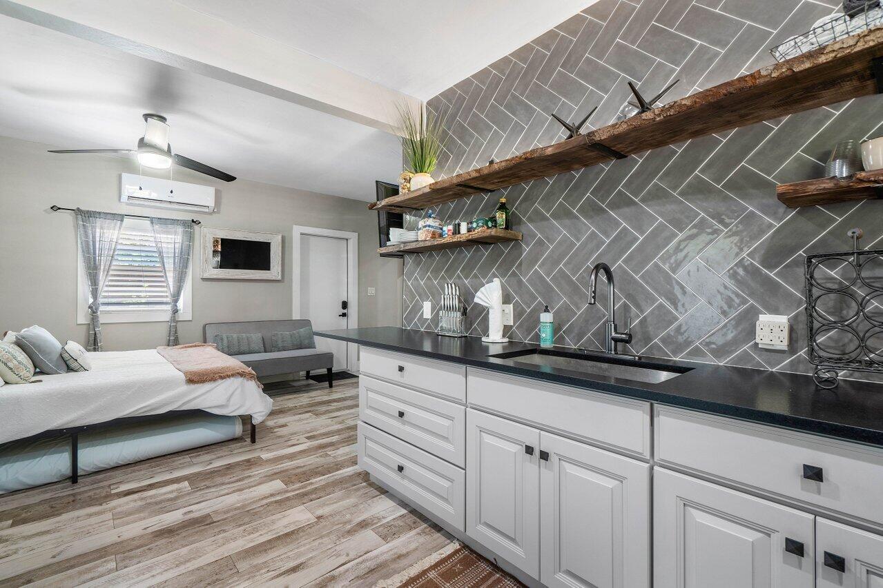 706 Sunset Road, Unit C West Palm Beach, FL 33401 - Photo 7 of 15 a living room with furniture and wooden floor