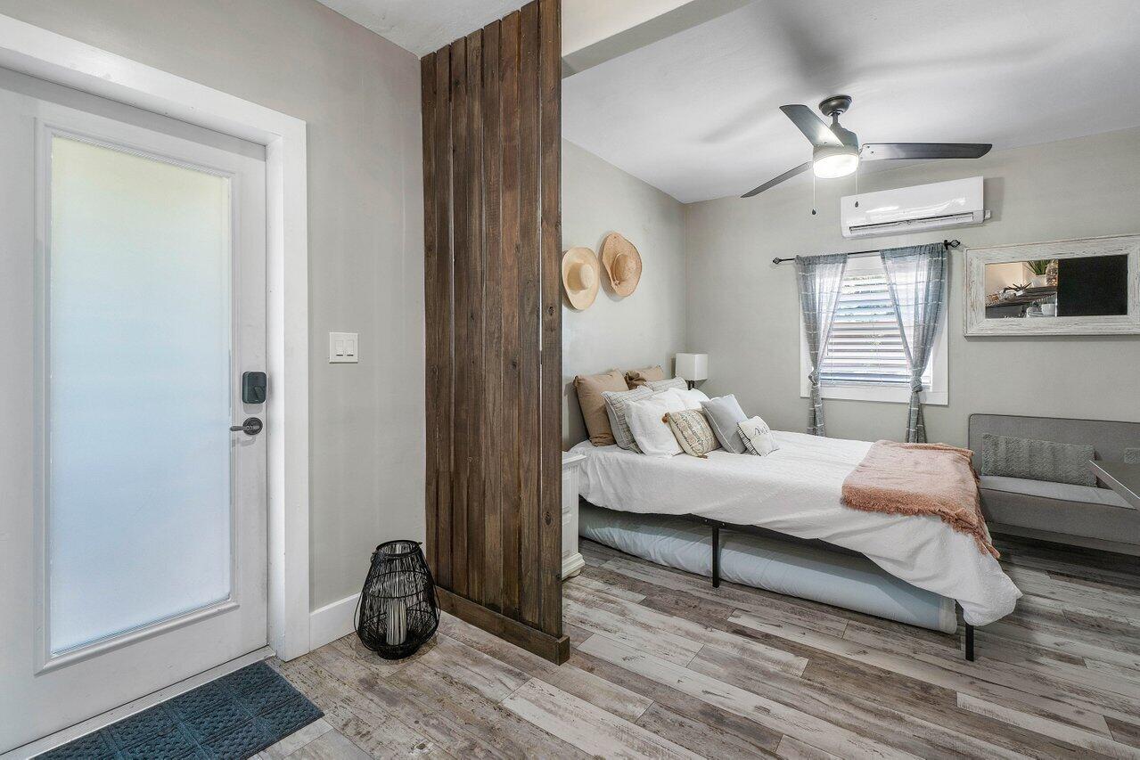 706 Sunset Road, Unit C West Palm Beach, FL 33401 - Photo 8 of 15 a living room with furniture and a window