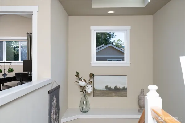 a bathroom with a bathtub and a window