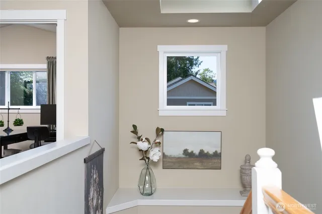 a bathroom with a bathtub and a window