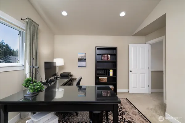 a view of a workspace with furniture