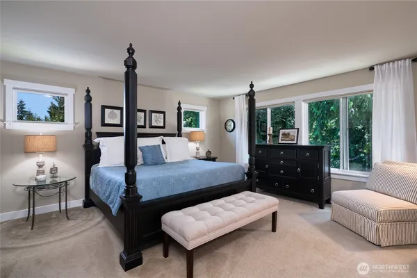 a bedroom with a bed and a couch