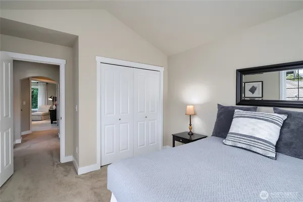a bedroom with a bed and a view of en suite bathroom