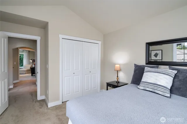 a bedroom with a bed and a view of en suite bathroom