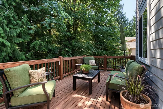 a view of balcony with furniture and wooden deck