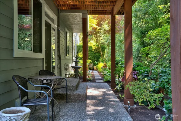 a view of a pathway with flower plants