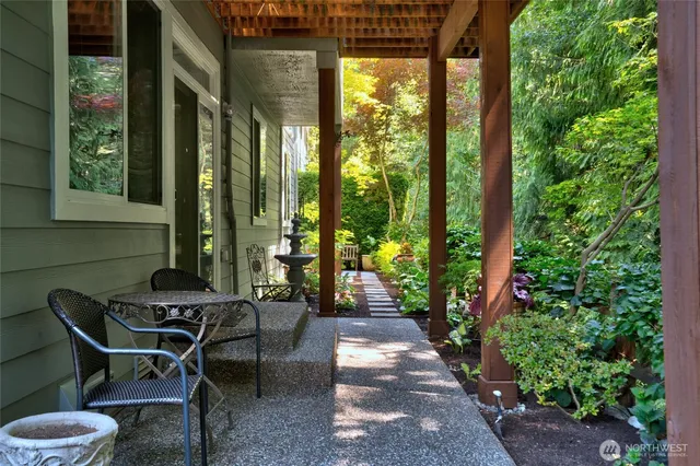 a view of a pathway with flower plants