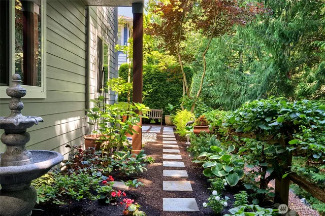 a view of backyard with sitting area