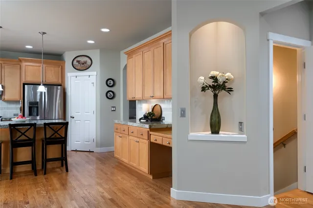 a view of kitchen with furniture and wooden floor