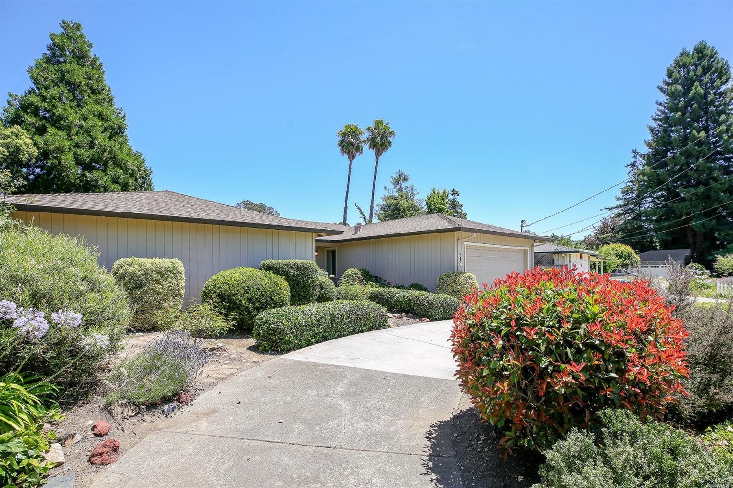 214 Calistoga Road Santa Rosa, CA 95409 - Photo 1 of 1 a vase of flowers sitting in front of a house