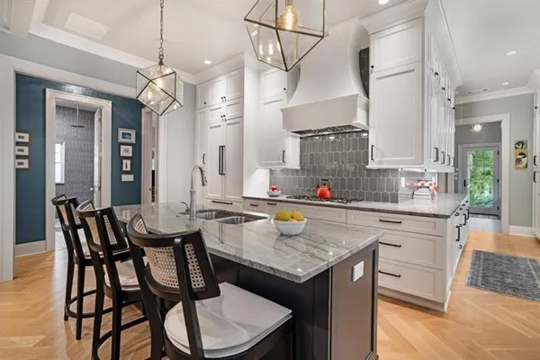 a kitchen with a table and chairs in it