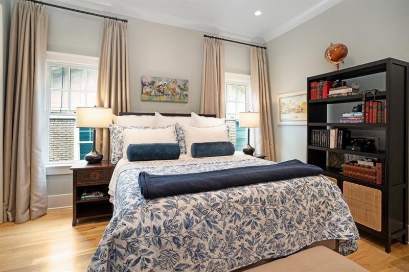 407 8th Street Northeast Atlanta, GA 30309 - Photo 21 of 34 a bedroom with a bed and wooden floor