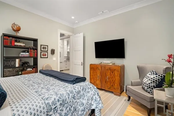 a bathroom with a granite countertop sink a mirror and shower