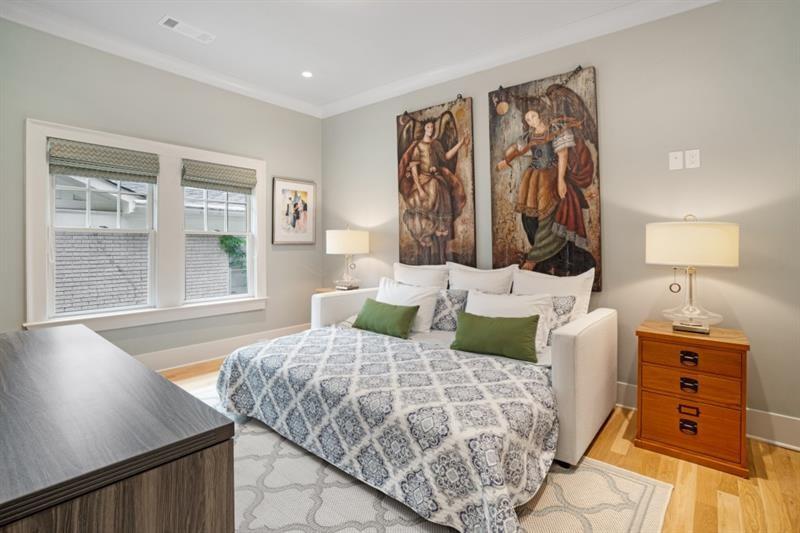 407 8th Street Northeast Atlanta, GA 30309 - Photo 26 of 34 a bedroom with a bed and a window