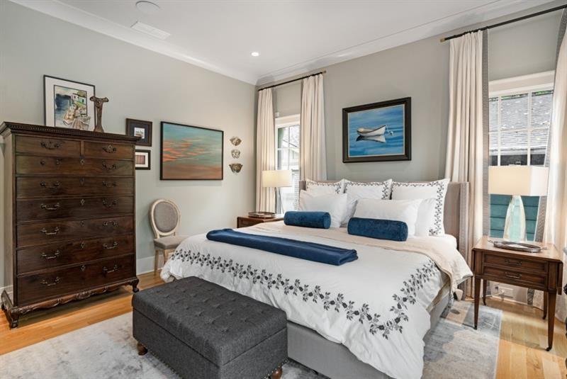 407 8th Street Northeast Atlanta, GA 30309 - Photo 29 of 34 a bedroom with a bed and a dresser