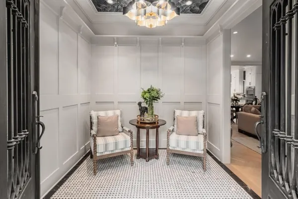 a view of a dining room with furniture and a potted plant