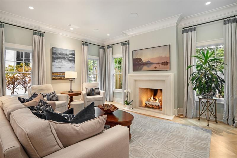 407 8th Street Northeast Atlanta, GA 30309 - Photo 7 of 34 a living room with furniture a fireplace and a large window