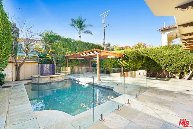 a view of a swimming pool with a patio