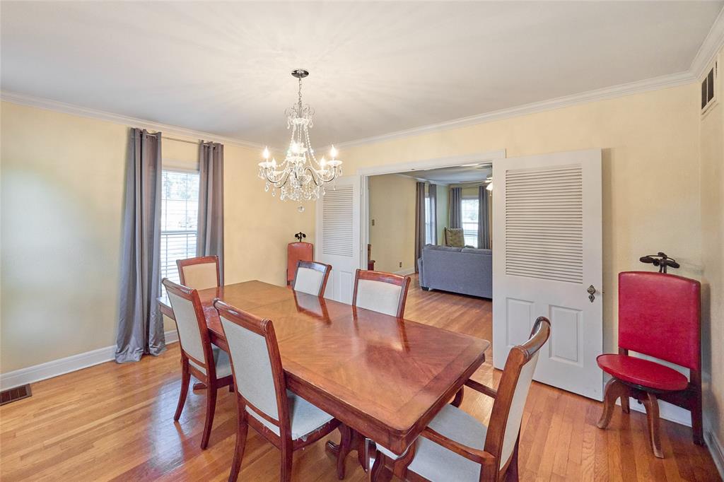 811 West Main Street Olney, TX 76374 - Photo 12 of 40 a view of a dining room with furniture and wooden floor