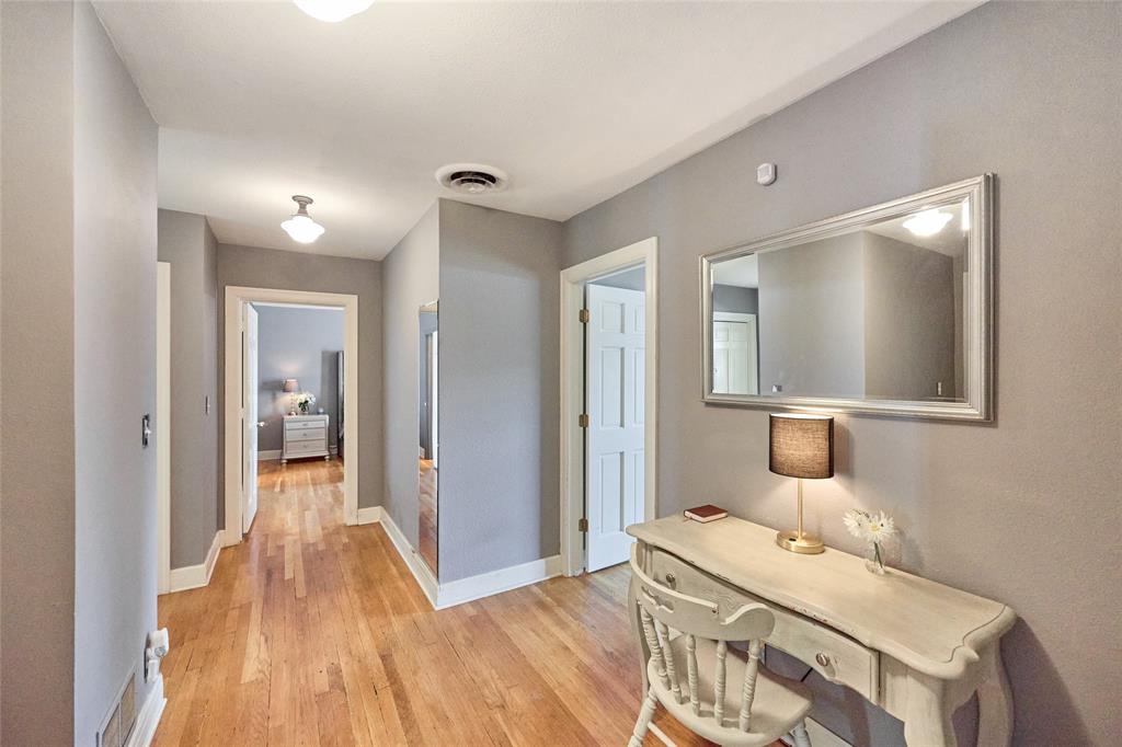 811 West Main Street Olney, TX 76374 - Photo 22 of 40 a bedroom with a bed and wooden floor