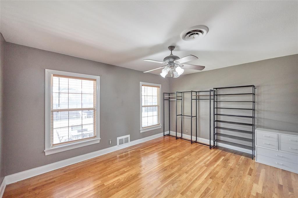 811 West Main Street Olney, TX 76374 - Photo 27 of 40 a view of a livingroom with a chandelier fan and windows