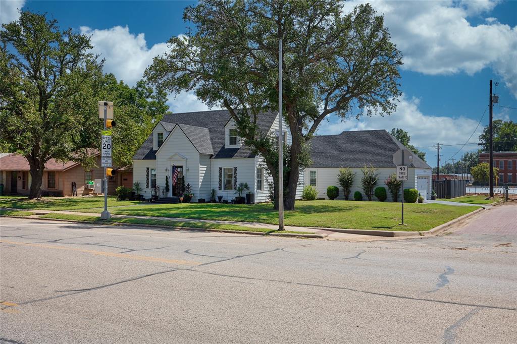 811 West Main Street Olney, TX 76374 - Photo 3 of 40 a view of house with backyard and trees