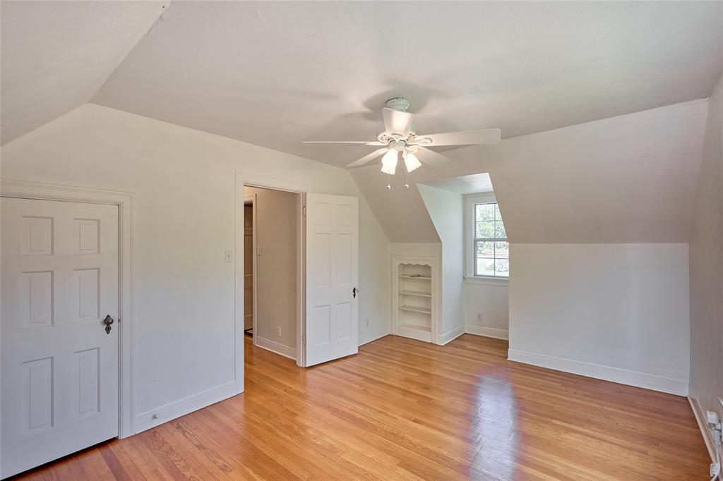 811 West Main Street Olney, TX 76374 - Photo 35 of 40 wooden floor in an empty room with a window