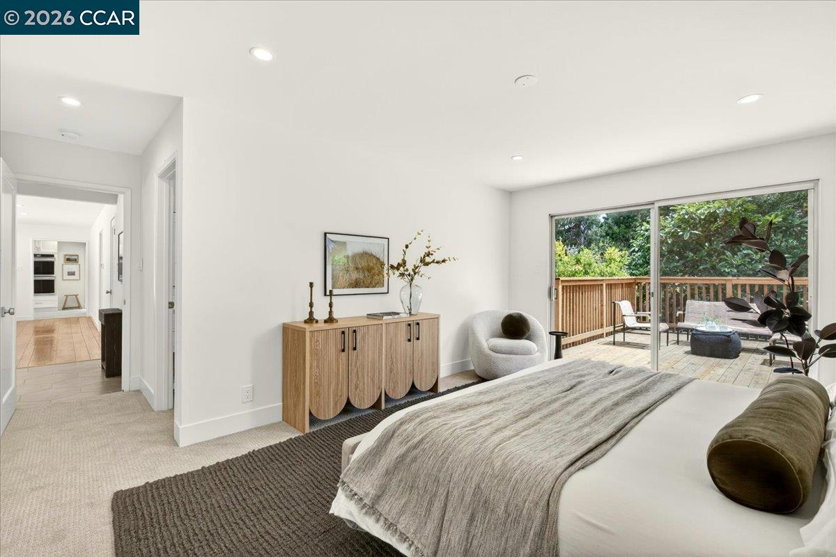 24 Las Vegas Road Orinda, CA 94563 - Photo 22 of 47 a bedroom with a bed and wooden floor