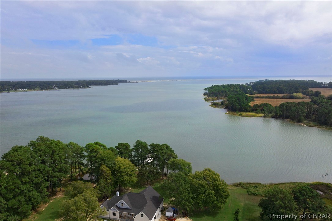 140 Mill Point Road Hudgins, VA 23076 - Photo 43 of 47 an aerial view of a houses with a lake view