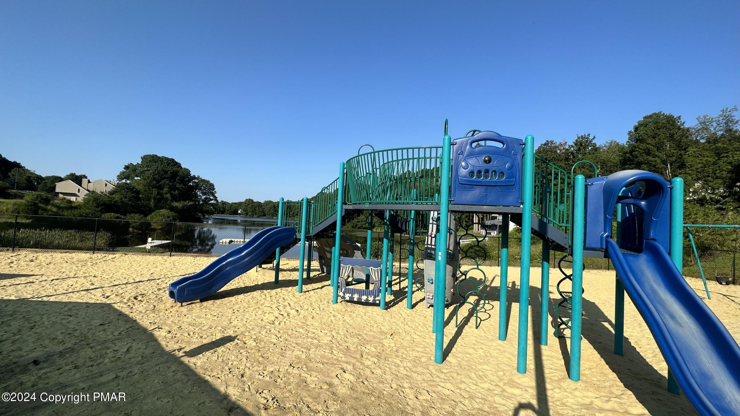 Lot 139 Berkshire Court Bushkill, PA 18324 - Photo 20 of 52 a view of a swimming pool with a slide and potted plants