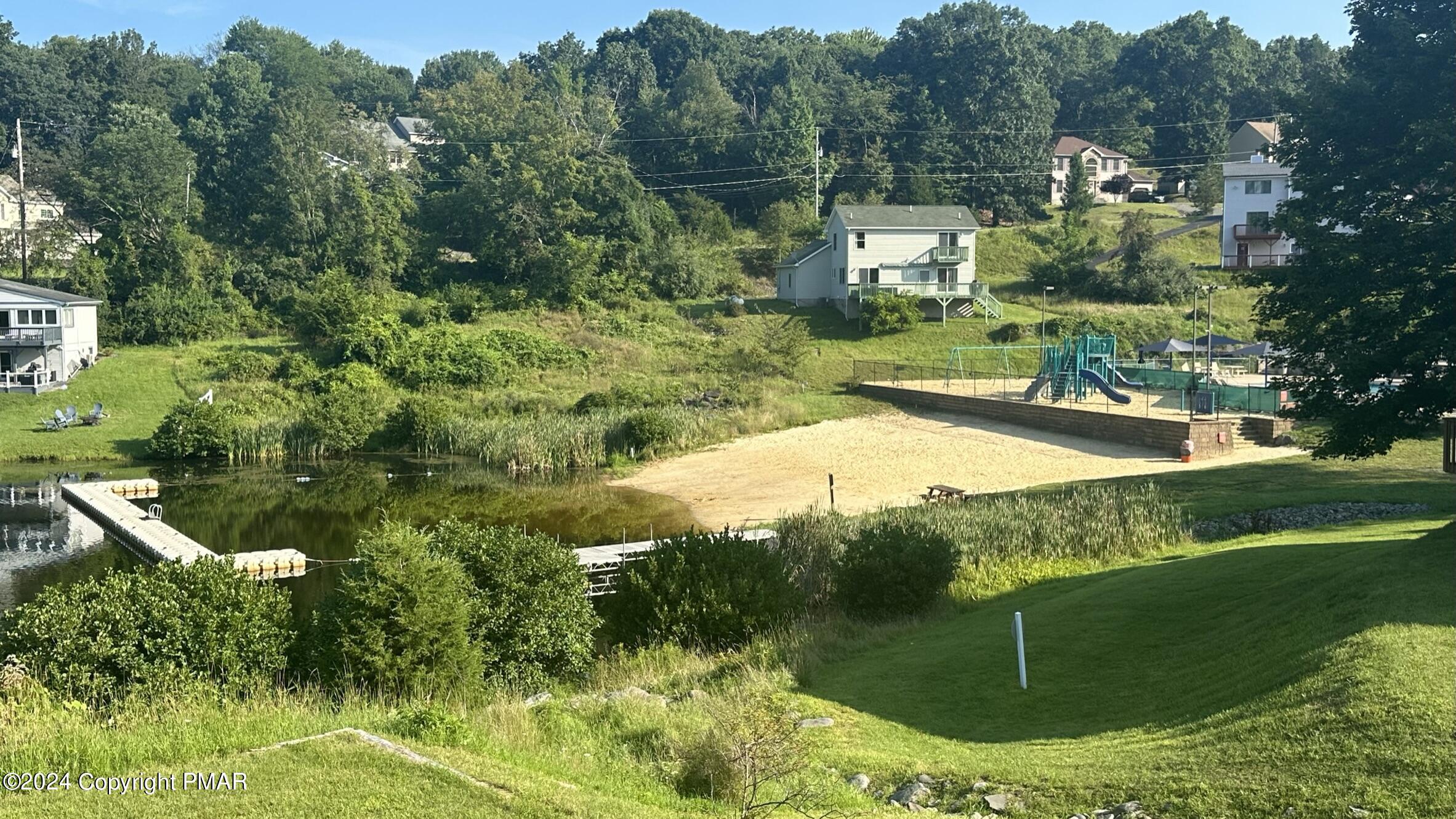 Lot 139 Berkshire Court Bushkill, PA 18324 - Photo 25 of 52 a view of a garden with a fountain