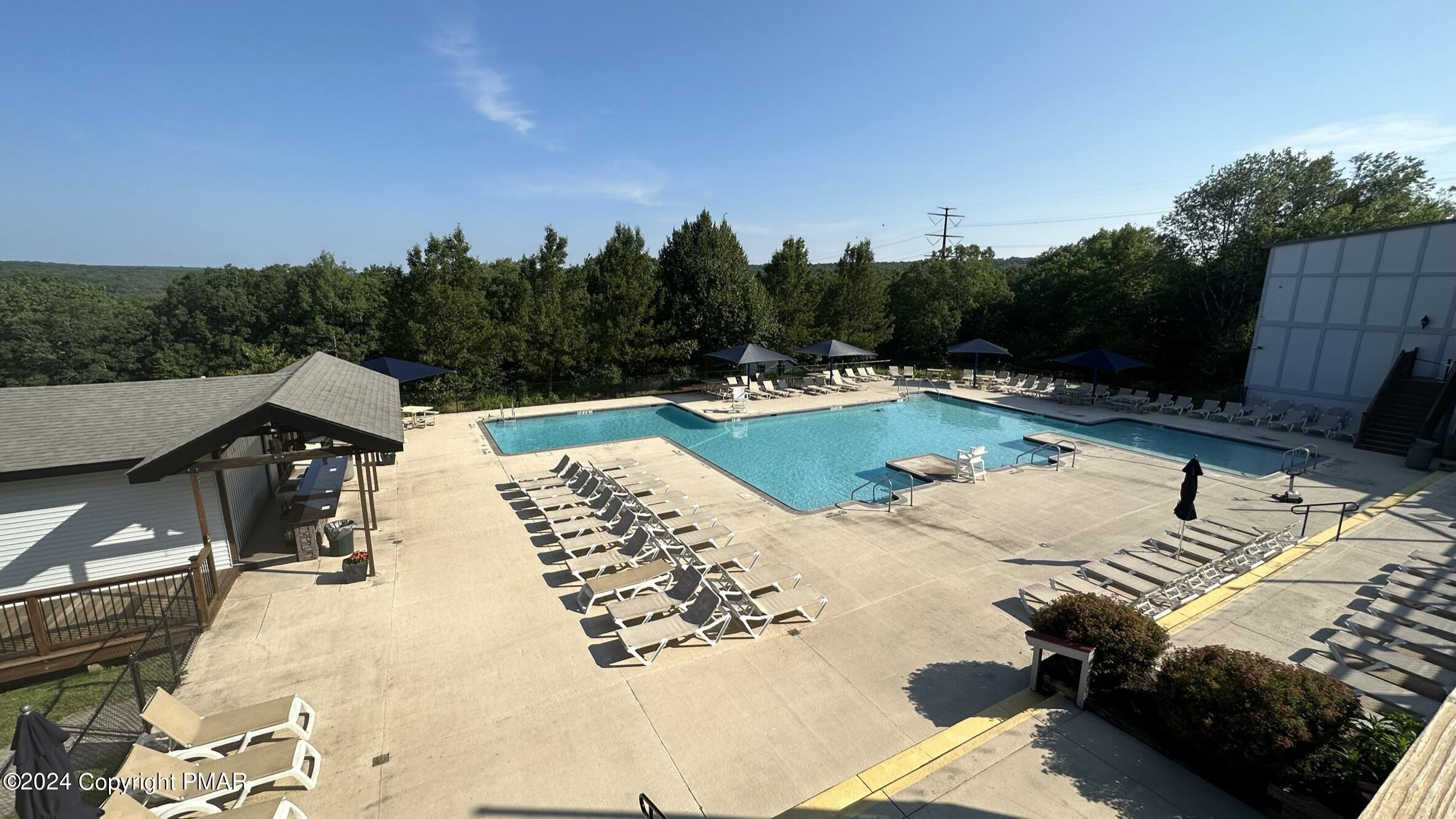 Lot 139 Berkshire Court Bushkill, PA 18324 - Photo 39 of 52 a view of a swimming pool with lounge chair