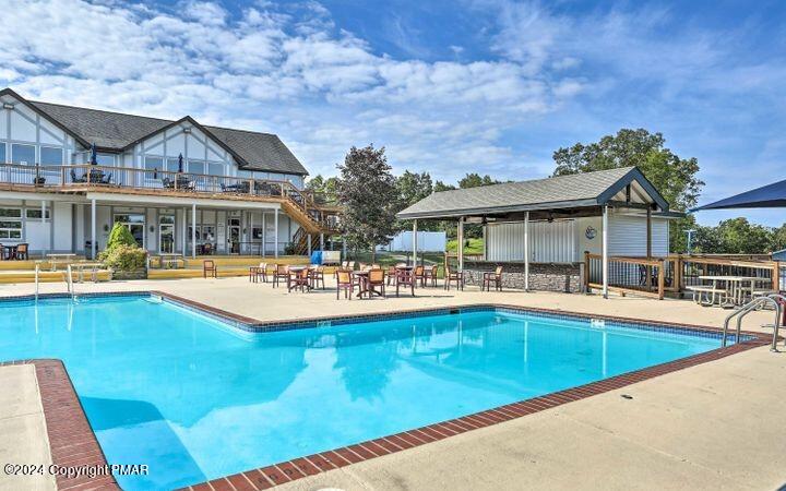 Lot 139 Berkshire Court Bushkill, PA 18324 - Photo 41 of 52 a view of a house with swimming pool and porch