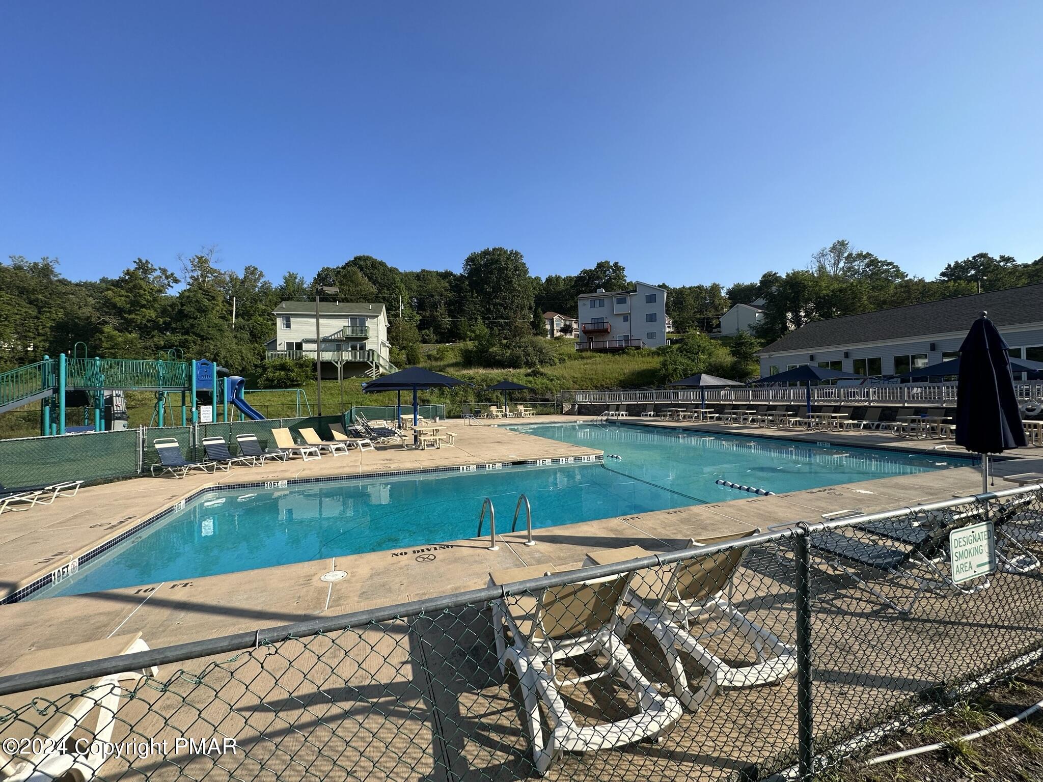 Lot 139 Berkshire Court Bushkill, PA 18324 - Photo 10 of 52 a view of a swimming pool with a yard and sitting area