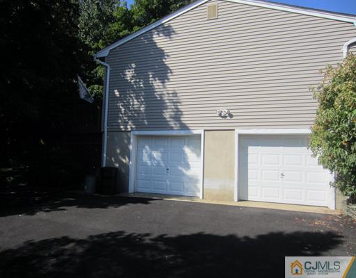 16 Kings Road East Brunswick, NJ 08816 - Photo 22 of 22 a front view of a house with a garage
