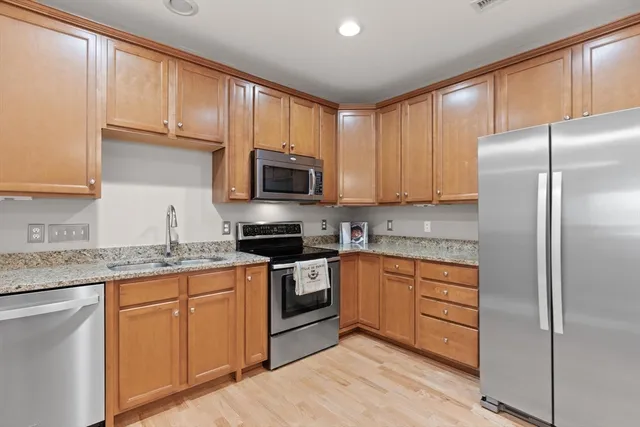 a bedroom with a bed and a lamp