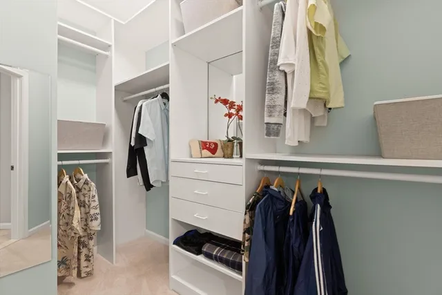 a view of a storage & utility room with dryer and washer