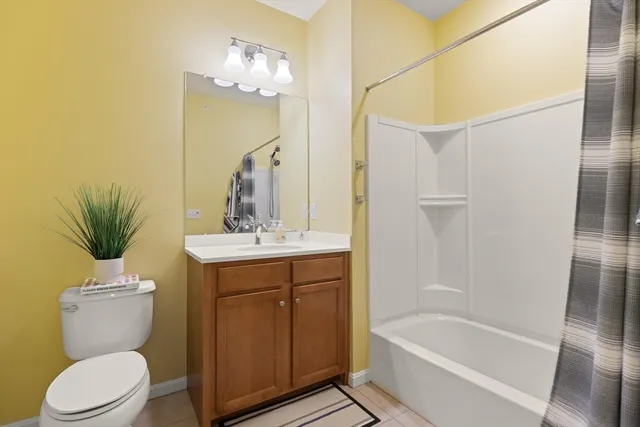 a room with gym equipment and a large window