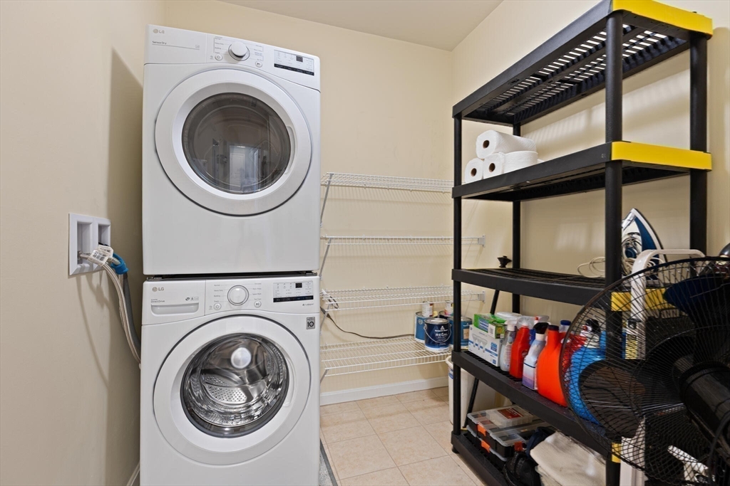 418 John Mahar Highway, Unit 408 Braintree, MA 02184 - Photo 21 of 35 a view of a storage & utility room with dryer and washer