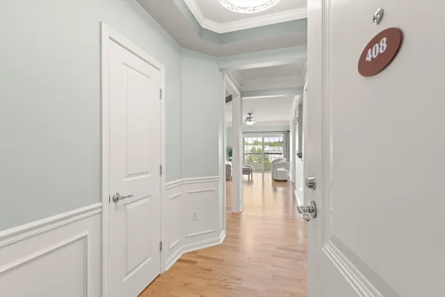 a bedroom with furniture and a large window