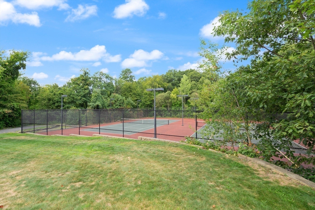 418 John Mahar Highway, Unit 408 Braintree, MA 02184 - Photo 31 of 35 a view of a backyard with a slide
