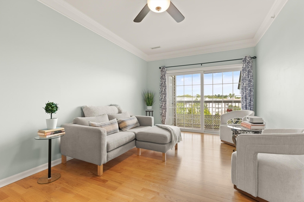 418 John Mahar Highway, Unit 408 Braintree, MA 02184 - Photo 5 of 35 a bedroom with furniture and a large window