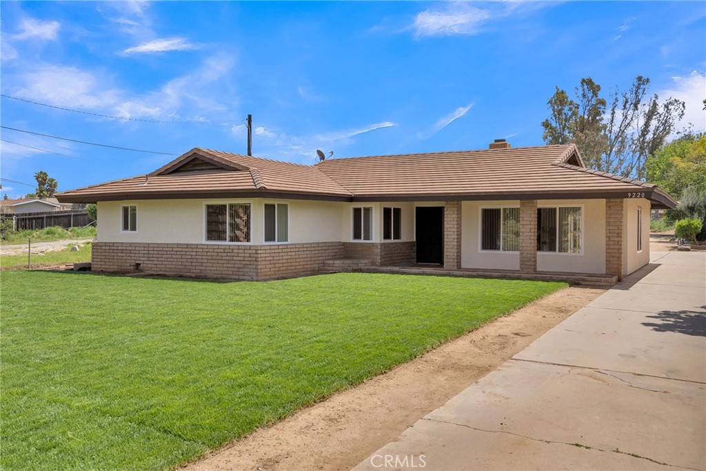 9220 Audrey Street Riverside, CA 92503 - Photo 1 of 1 a front view of a house with a garden