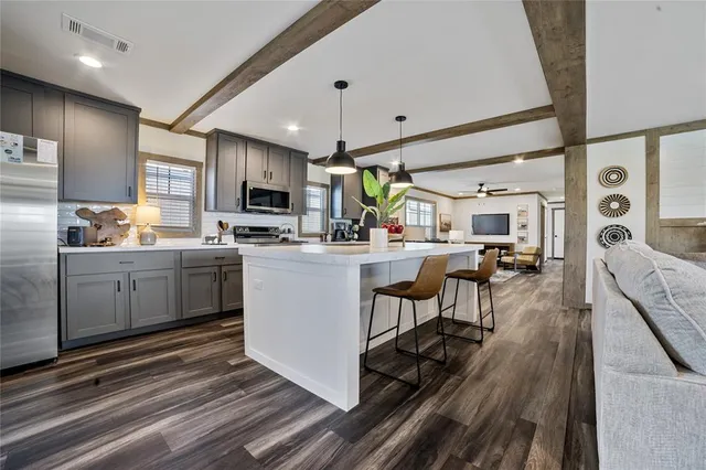 a kitchen with sink cabinets and window