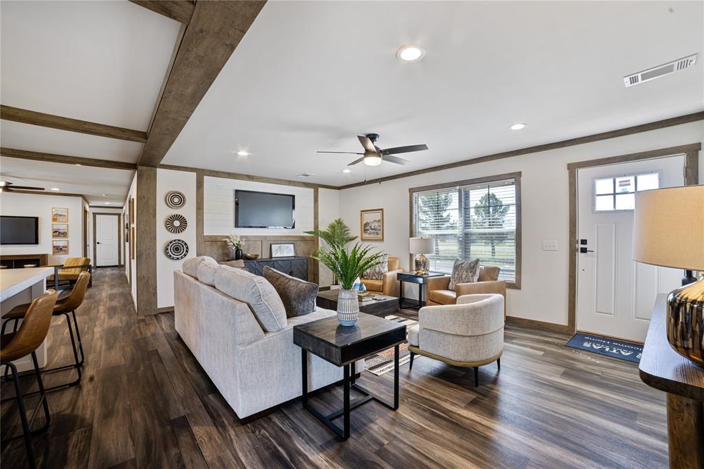 2004 Buffet Way Poolville, TX 76487 - Photo 13 of 36 a living room with furniture a wooden floor and a window