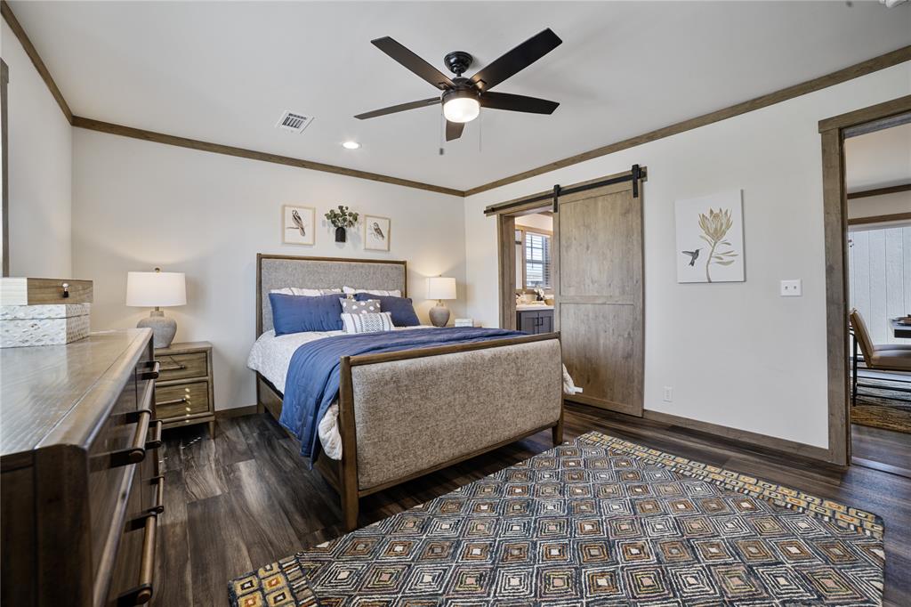 2004 Buffet Way Poolville, TX 76487 - Photo 19 of 36 a bedroom with a bed and a dresser with wooden floor