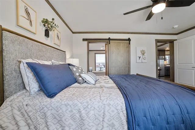 a bedroom with bed and window