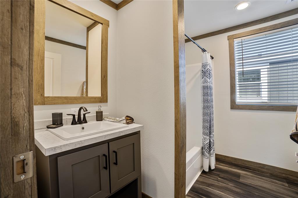 2004 Buffet Way Poolville, TX 76487 - Photo 32 of 36 a bathroom with a sink and a mirror