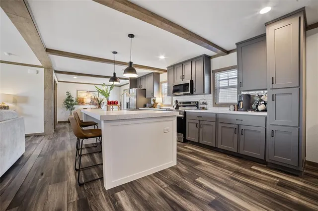 a kitchen with sink cabinets and window